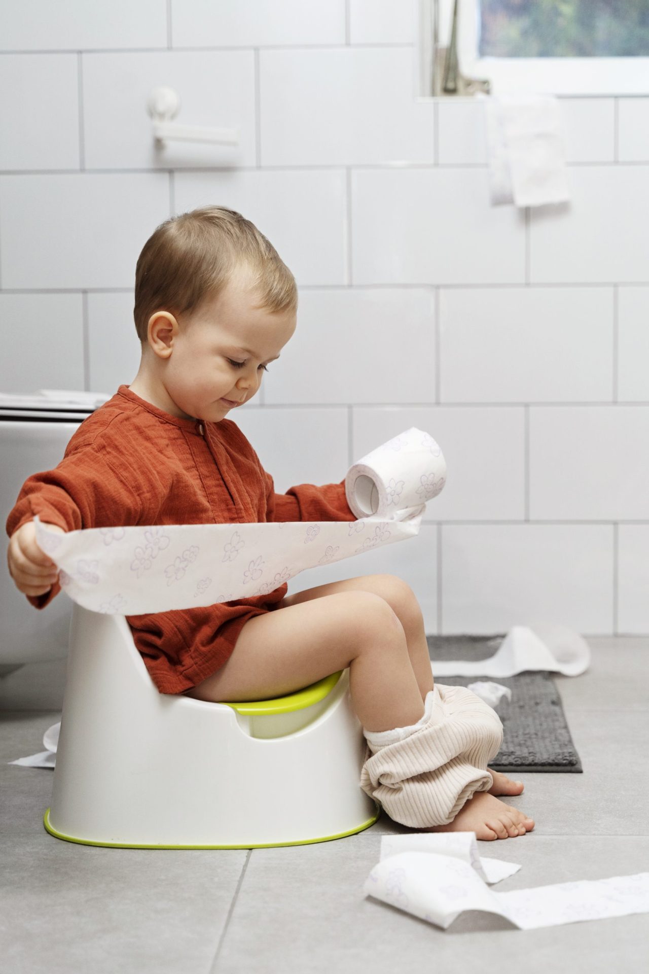 full-shot-cute-kid-holding-toilet-paper
