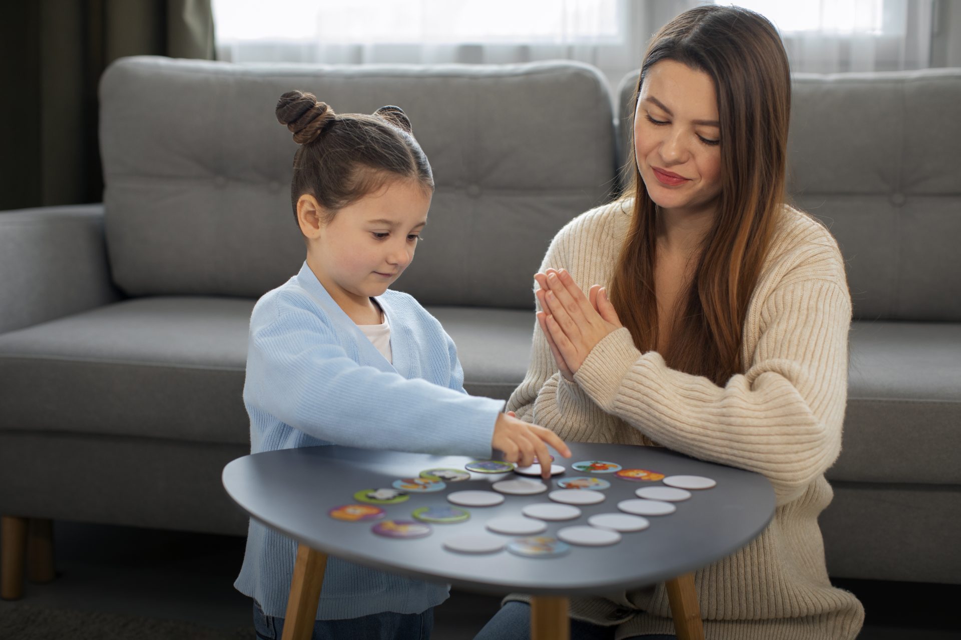 front-view-mother-girl-playing-game