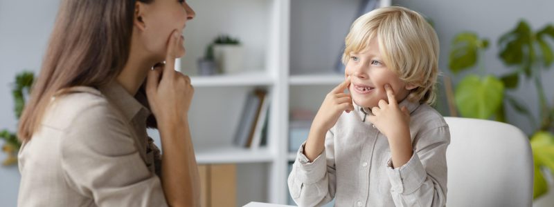 woman-doing-speech-therapy-with-little-blonde-boy-1-scaled